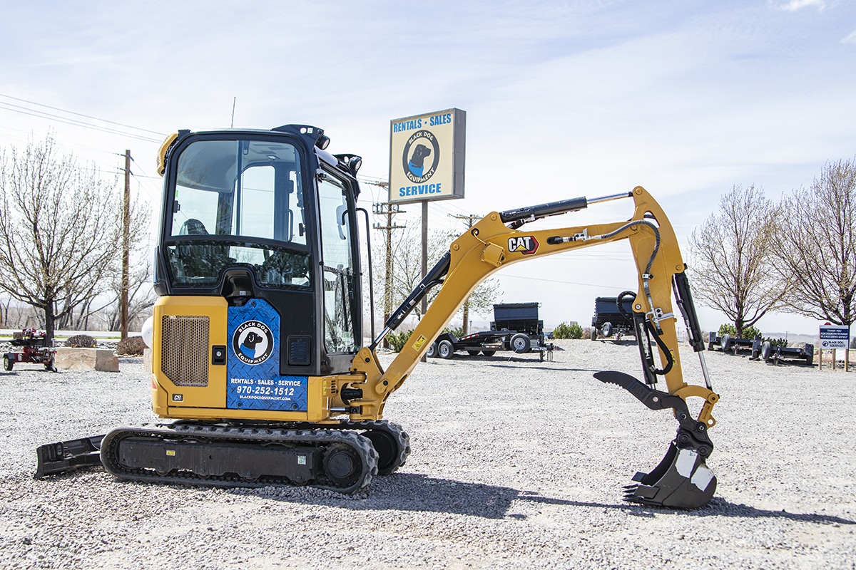 Side profile of Caterpillar 302 Mini Excavator for rent