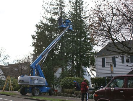 using a lift to hang christmas lights